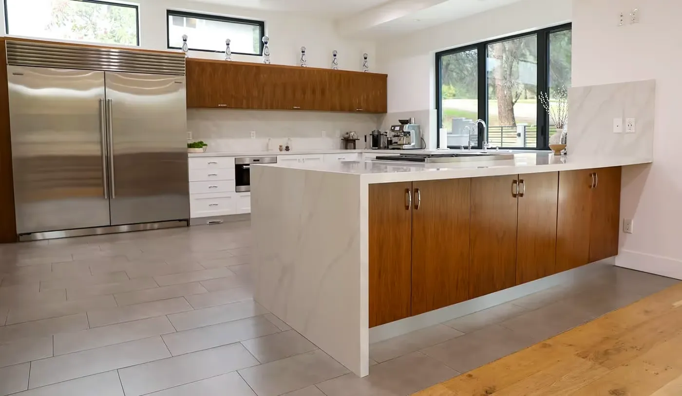 Modern kitchen with large white island and wooden cabinets